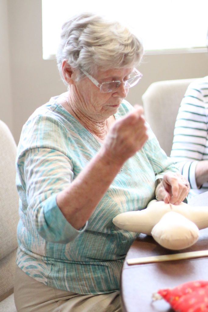sewing a medical play doll