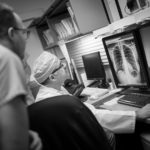 Dr. Faidi reviews a chest x-ray