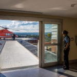 Security guard waits for paramedics to remove patient from the air ambulance