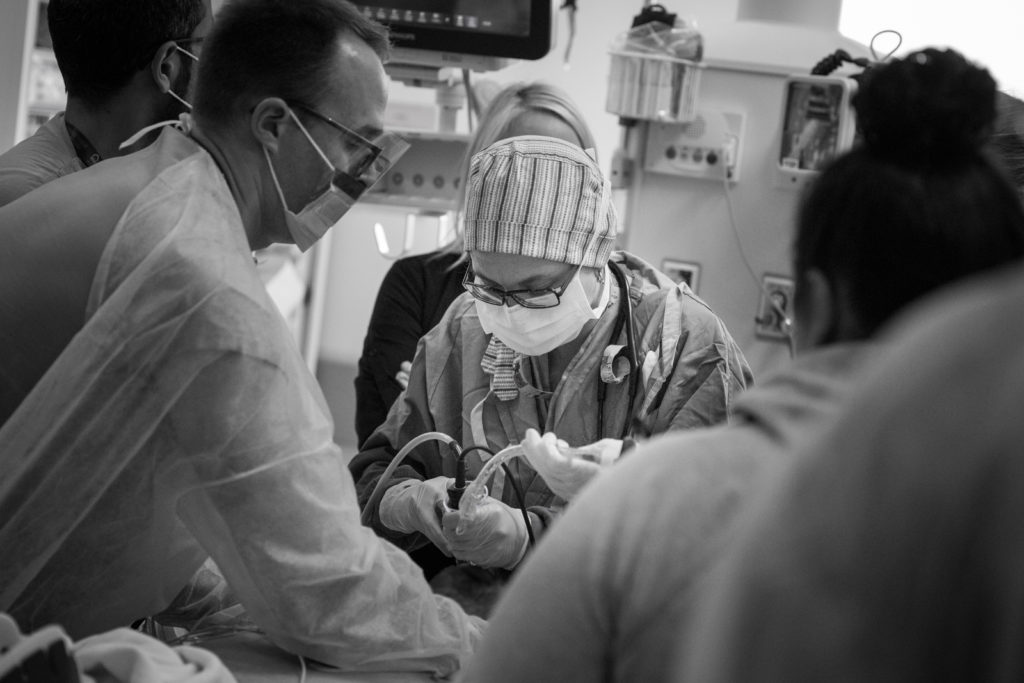 anesthesiologist intubates a patient