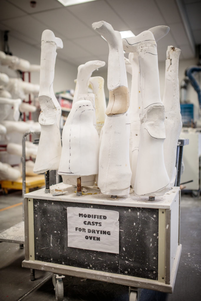 A collection of casts at various stages of adjustment getting ready for the plastic devices to be molded.