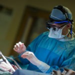Dr. Whitlock inserts electrical wires to help pace the patient’s heart as it recovers from surgery. The wires will stay in the patient’s chest for three days.