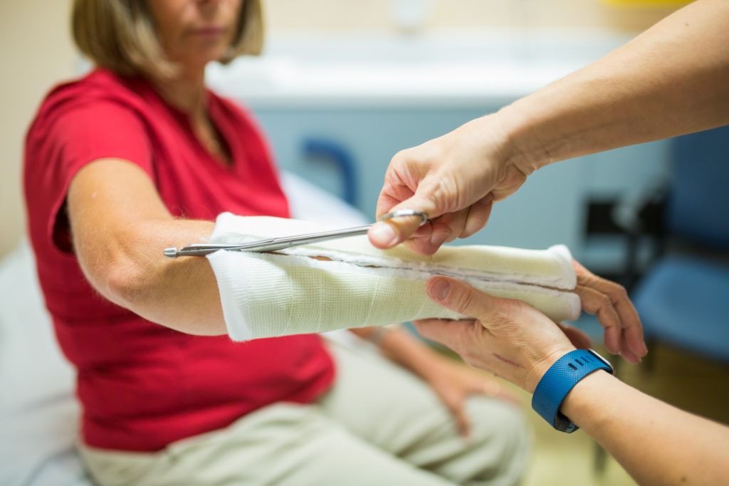 Lady getting a cast removed