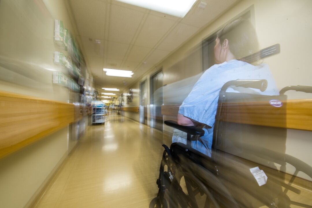 blurred photo of a patient in a wheelchair