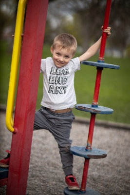 Lucas fully recovered playing at a playground 