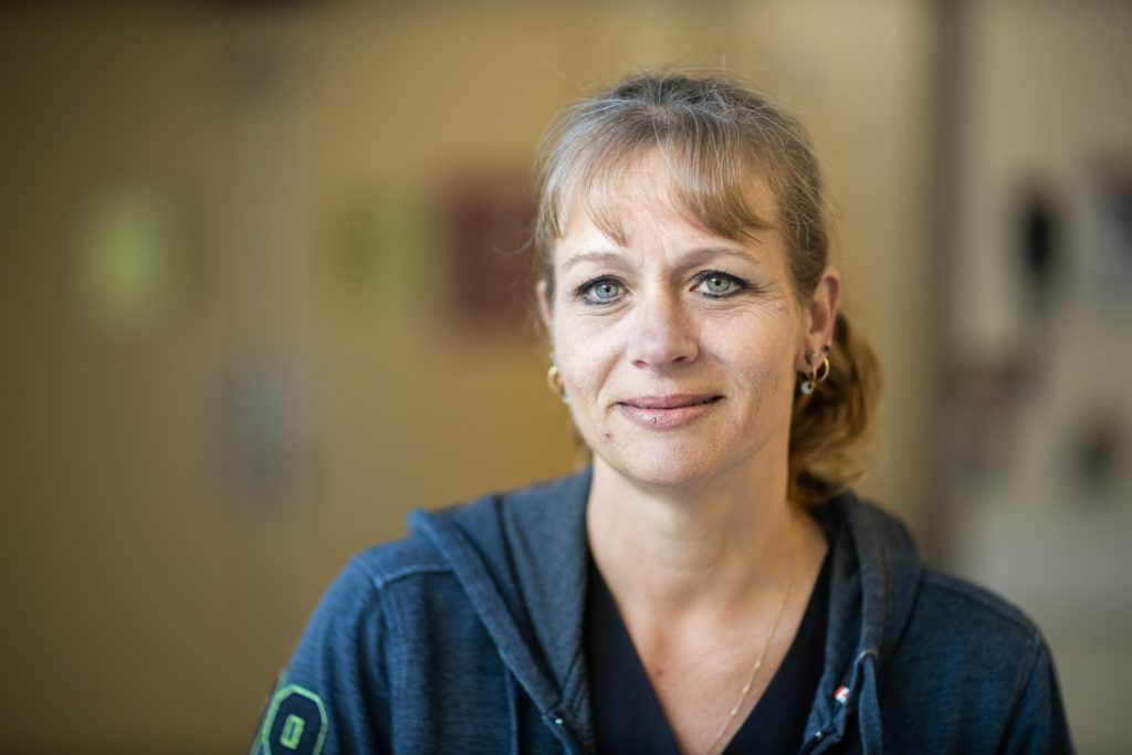 A nutrition associate stands in portrait