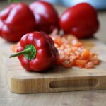 a red pepper on a cutting board