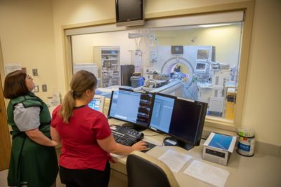 Sophie is slowly moved into the CT scanner while medical radiation technologist, Heather McLean captures images. The CT scanner is like a 360 degree X-ray that photographs Sophie’s entire body.