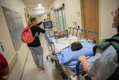 Everything has to be transported with Sophie. Sedation team charge nurse, Kaitlyn Murray, pushes a portable vital signs monitor which continually tracks Sophie’s heart rate and breathing.