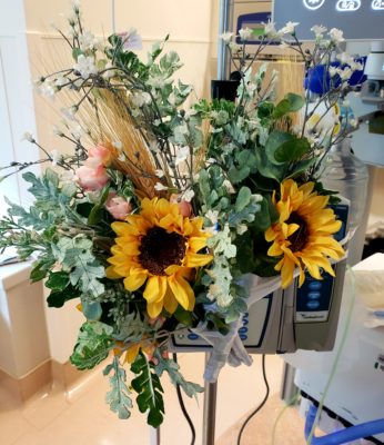 Flowers attached to a pump in a hospital room