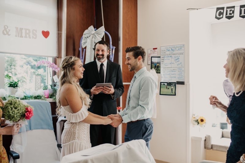 A couple gets married in a hospital room with minister presiding