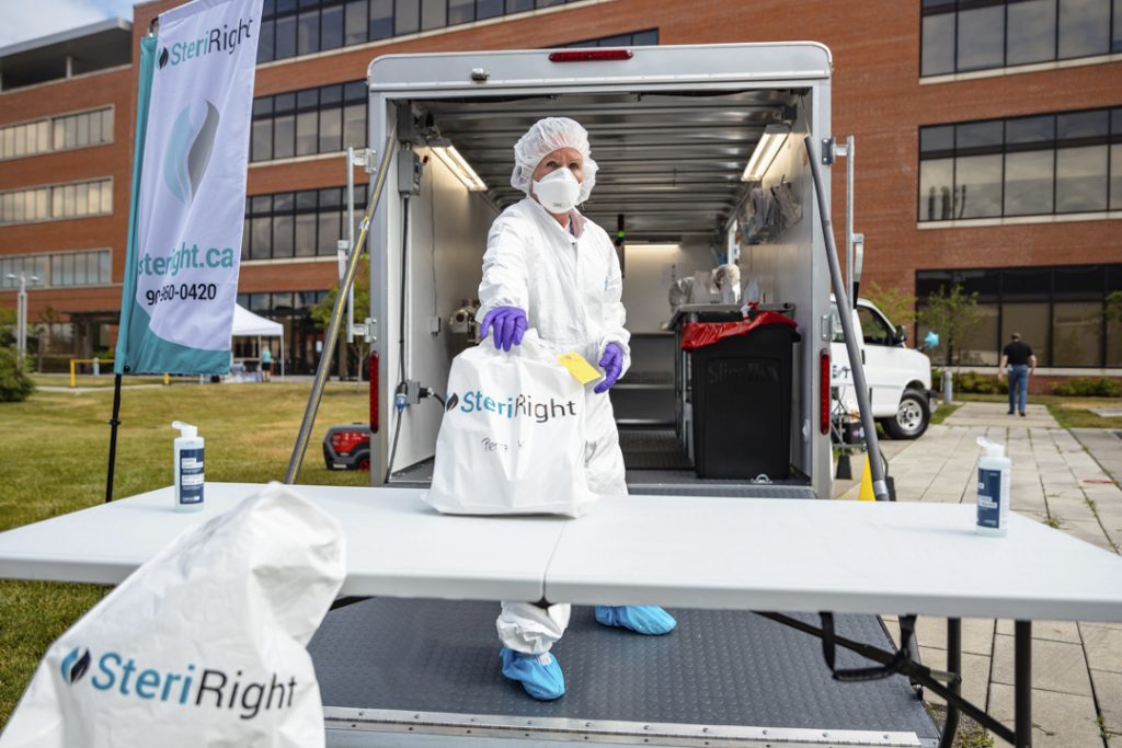 SteriRight mobile mask reprocessing and decontamination service set up outside with truck and table