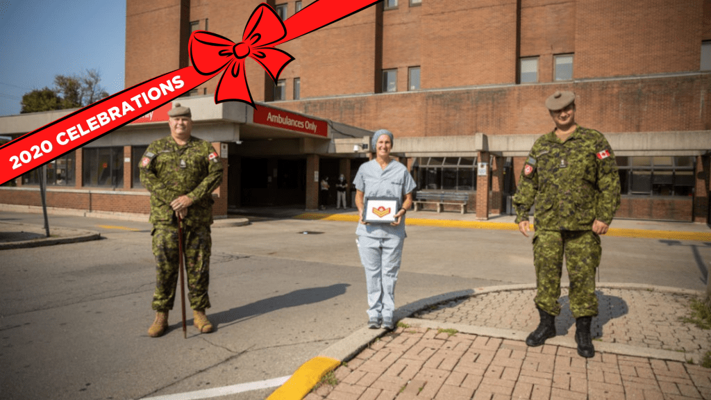 Regimental Sergeant Major, Chief Warrant Officer Grant Lawson (left) and Commanding Officer, Lieutenant Colonel Carlo Tittarelli (right) present HHS nurse Jacqueline Terence with her promotion outside Hamilton General Hospital.