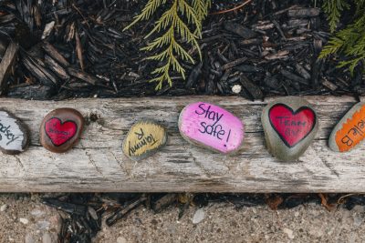 Rocks with messages of hope outside of Grace Villa