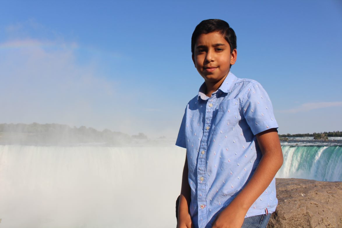 Daanish Kherani stands in front of Niagara Falls