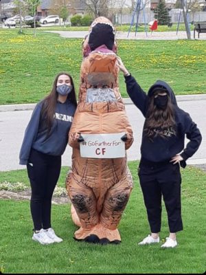 Mikayla and Madison with mom Tammy, who dressed up as a dinosaur to help raise funds during CF Awareness Month.