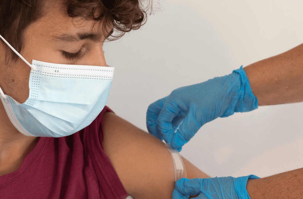 teen receiving the COVID-19 vaccine