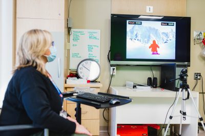 Kathie Elstone, recreation therapist, with VR equipment