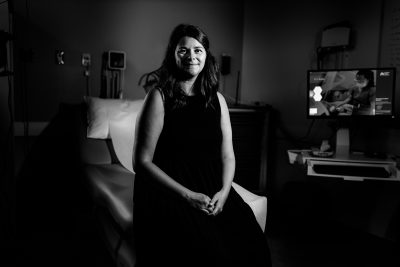 Samantha Dykstra, seated, black and white photo
