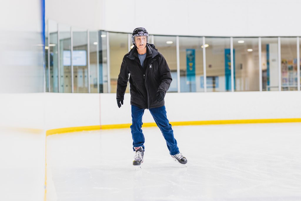 Mike Hudson, cardiac rehab patient, skating in an arena