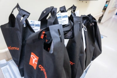 Black branded PC Optimum bags hold groceries from the Food Pantry