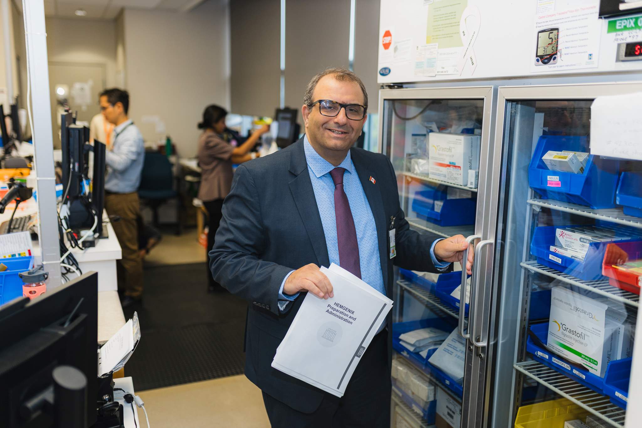 HHS outpatient pharmacies manager Wassim Houneini stands by a drug storage unitl