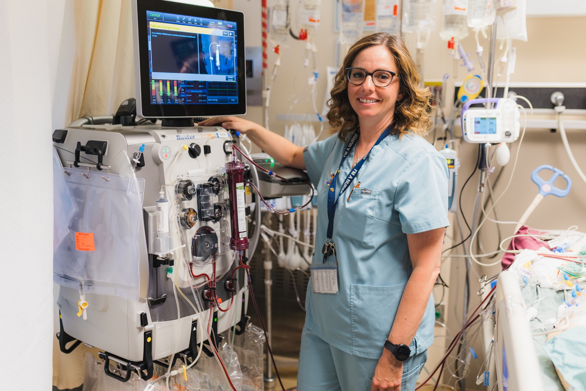 Stefanie Gasse is a registered nurse at our Hamilton General Hospital’s ICU. The seamless integration of data collected from various monitoring and therapy devices connected to the hospital’s sickest patients into the hospital’s Epic electronic medical records system is helping to ensure safer patient care and improved clinical workflows. In this photo she stands beside patient monitoring equipment.