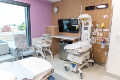 A hospital room includes a baby station