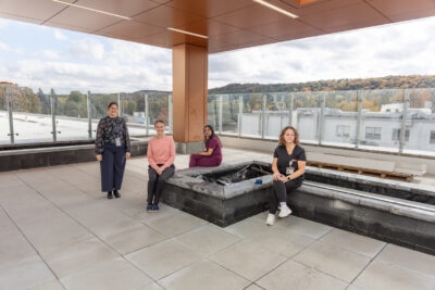 Four hospital staff on an outdoor terrace