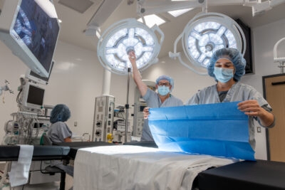 Masked staff in a surgical suite